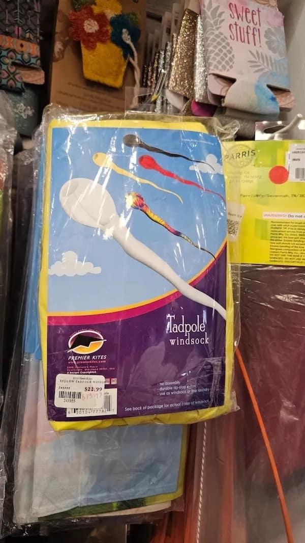 Tadpole windsock packaging resembling cartoon sperm in the sky