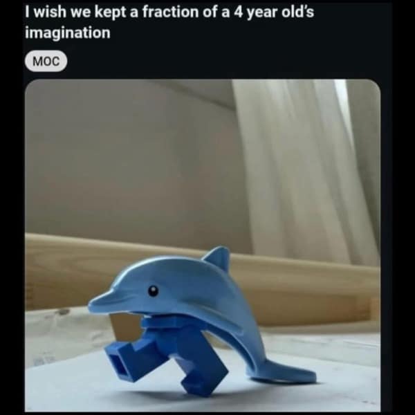 A funny meme of a toy dolphin with blue LEGO pants for legs, celebrating a child's imagination.