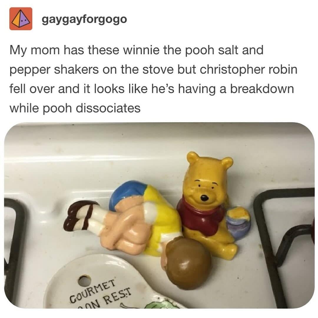 Winnie the Pooh and Christopher Robin salt shakers arranged to look like a comically tragic scene.