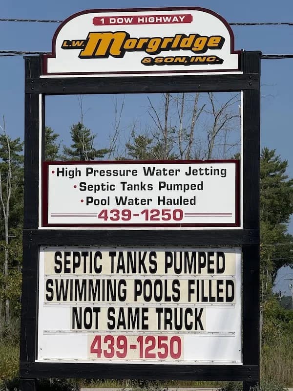 A funny picture of a septic company's sign clarifying they use different trucks for pools.