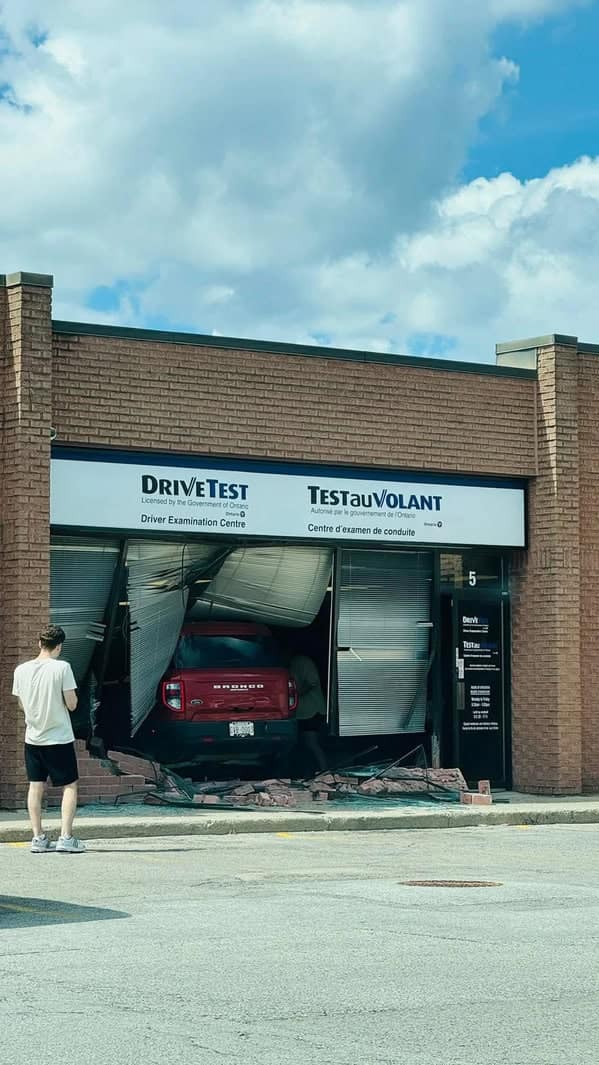 A funny pic showing the ultimate driving test fail: a car crashed into the test center.