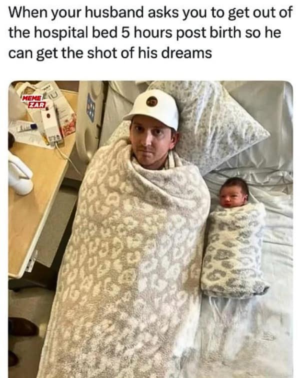 A funny picture of a dad and newborn swaddled in matching blankets in a hospital bed.