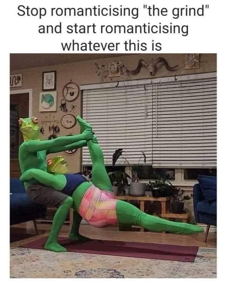 Two people in green bodysuits doing an unusual yoga pose