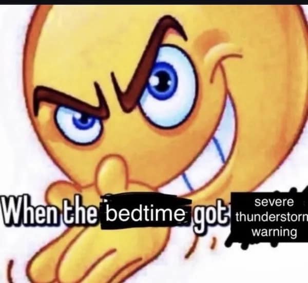 A funny picture of a mischievous emoji excited for a severe thunderstorm warning at bedtime.