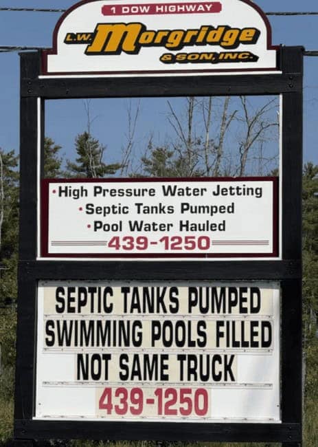 Business marquee: “Septic tanks pumped, swimming pools filled—NOT SAME TRUCK.”