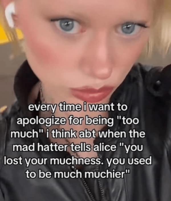Close-up of a woman with bold makeup and caption about being “too much”