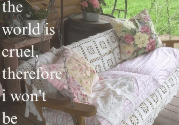 Cozy porch swing with floral pillows and a gentle quote about kindness