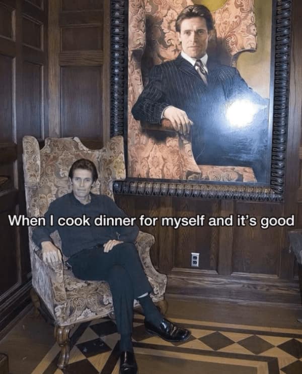 Man sitting proudly under a large portrait of himself in a formal chair