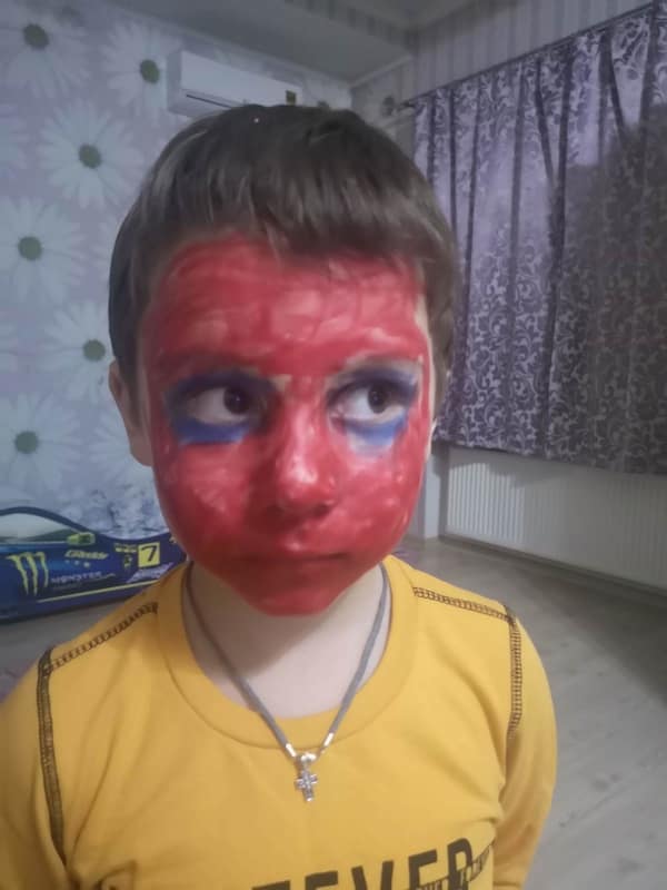 A funny example of kids breaking things where a boy uses makeup to become Spider-Man