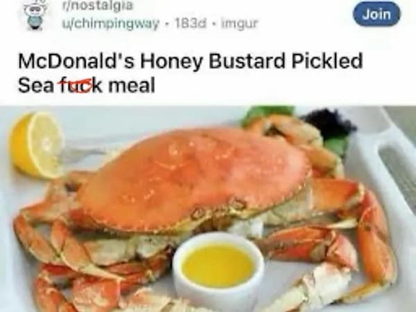 Reddit post with chaotic typos over a plate holding a whole crab, lemon wedge, and butter cup.