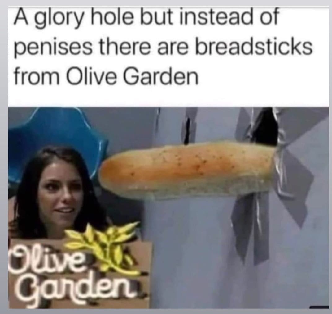 Olive Garden breadstick pokes through a duct-taped wall like a “glory hole” while a woman looks on.