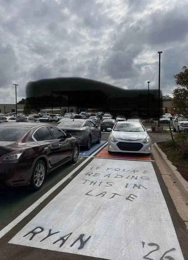 Senior parking spot painted ‘IF YOU’RE READING THIS I’M LATE – RYAN ’26