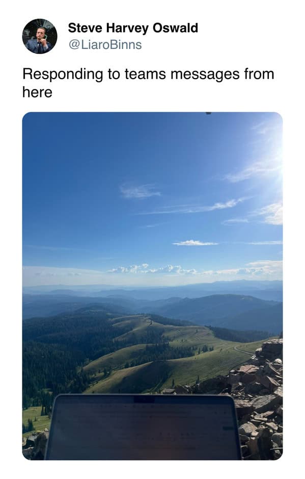 Steve Harvey Oswald’s tweet showing a scenic mountain view with a laptop in the foreground, captioned “Responding to teams messages from here”.