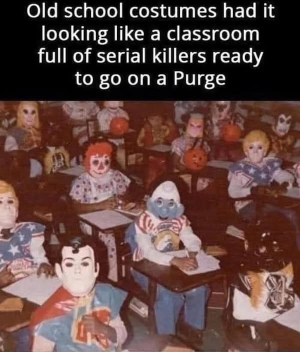 Vintage classroom full of kids in plastic Halloween masks (Superman, clown, Smurf), looking unintentionally creepy.