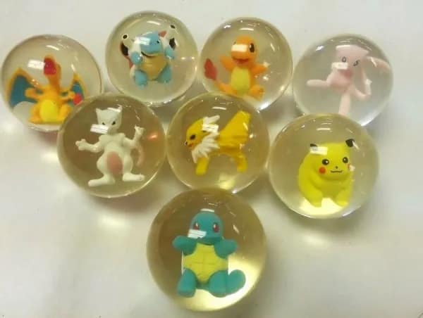 A nostalgic photo of 90s Pokémon characters inside clear rubber bouncy balls.
