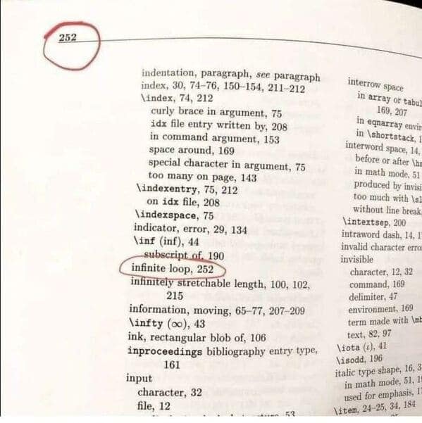 A red circle on a page of a book highlights the entry for "infinite loop."