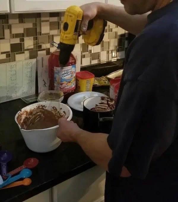 A piece of redneck engineering where a bicycle frame is used to mount a floodlight on a house.