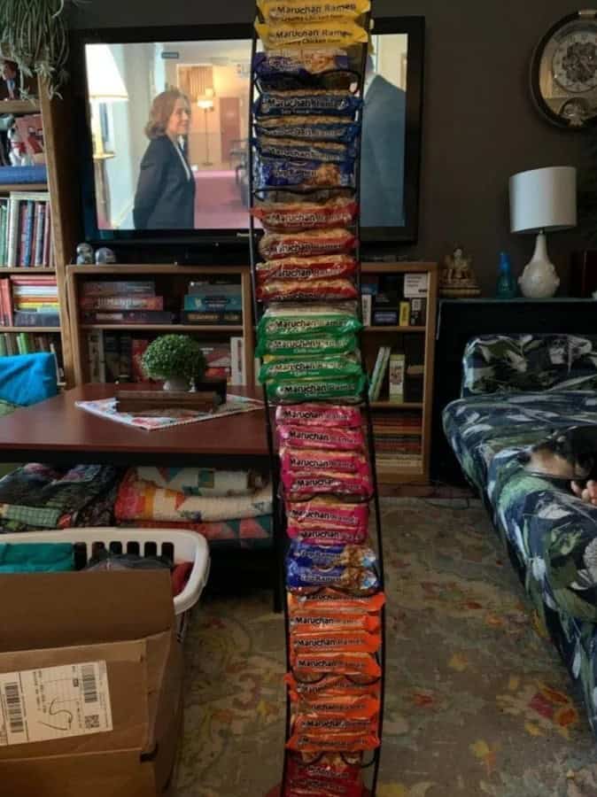 A vertical snack rack filled entirely with instant ramen packets, representing redneck ingenuity in pantry organization.