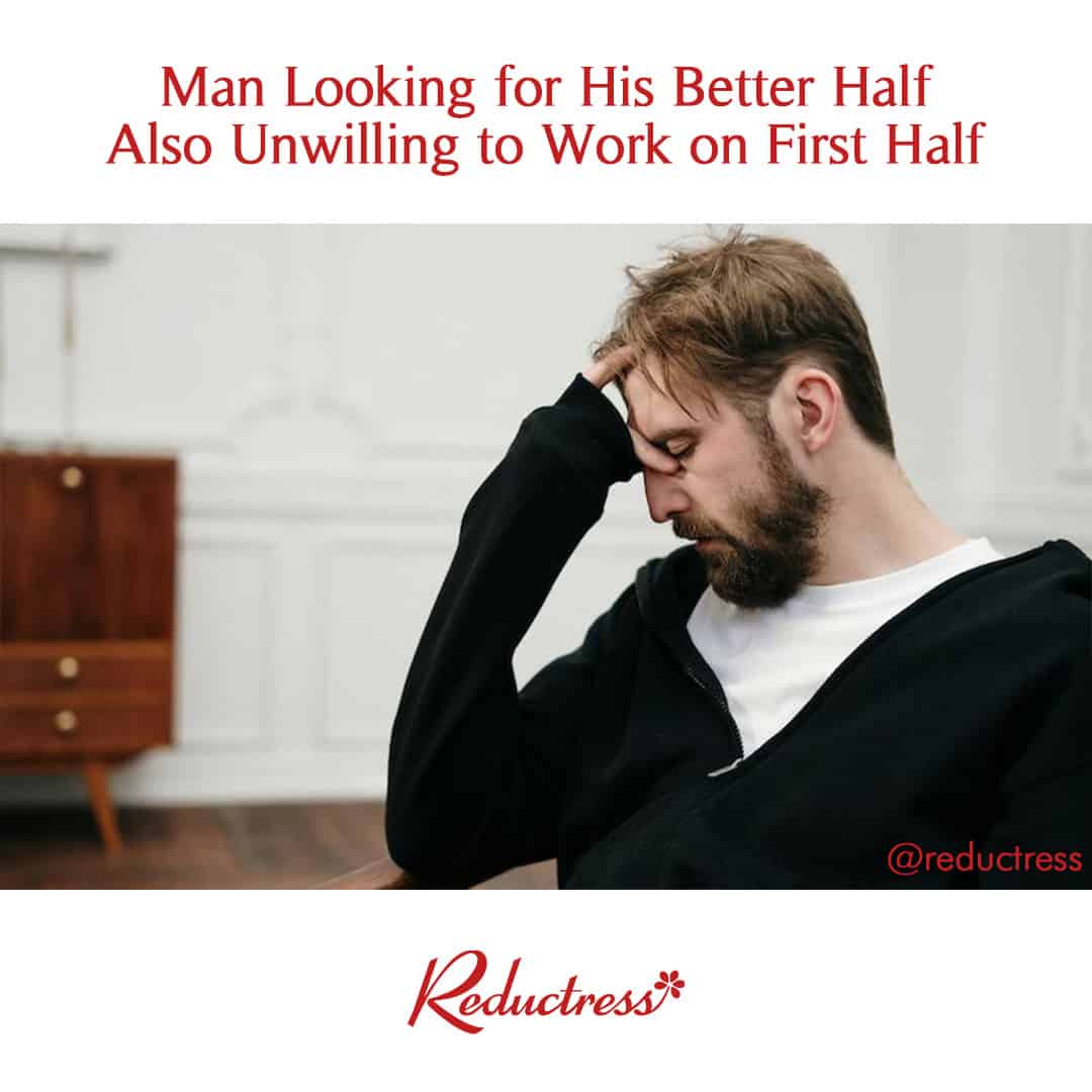 Man in a black hoodie holding his forehead in frustration; headline reads, "Man Looking for His Better Half Also Unwilling to Work on First Half."