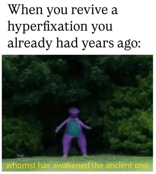 Blurry image of Barney the Dinosaur standing ominously in a wooded area.