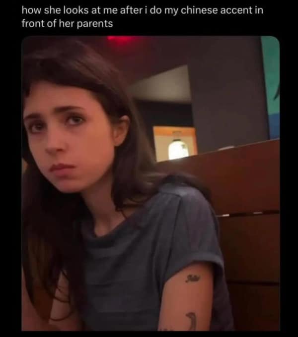 Young woman giving a disapproving side-eye at dinner, awkward date relatable meme