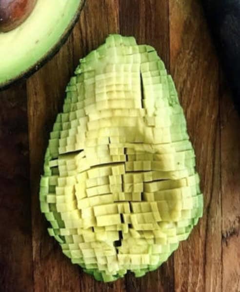 Avocado diced into a tiny square grid resembling pixel art