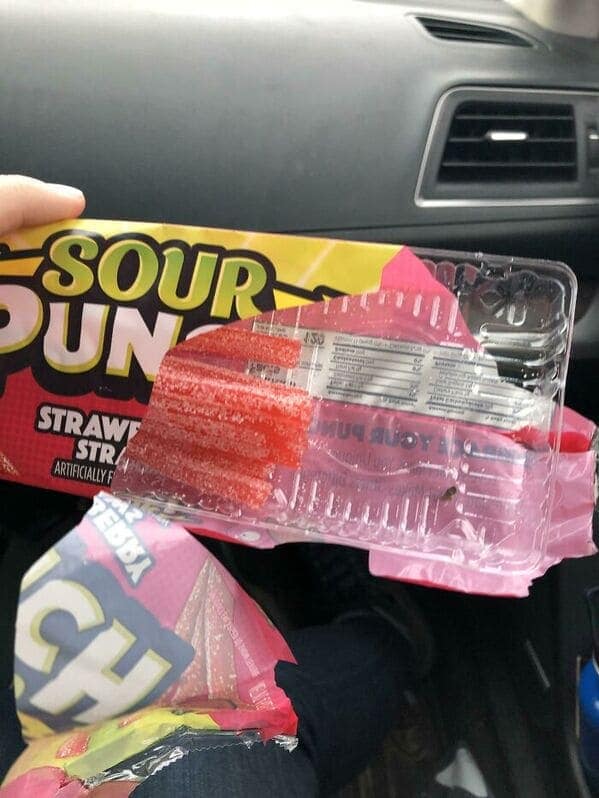 A shrinkflation example showing a Sour Punch candy tray that is only half-filled with actual candy.