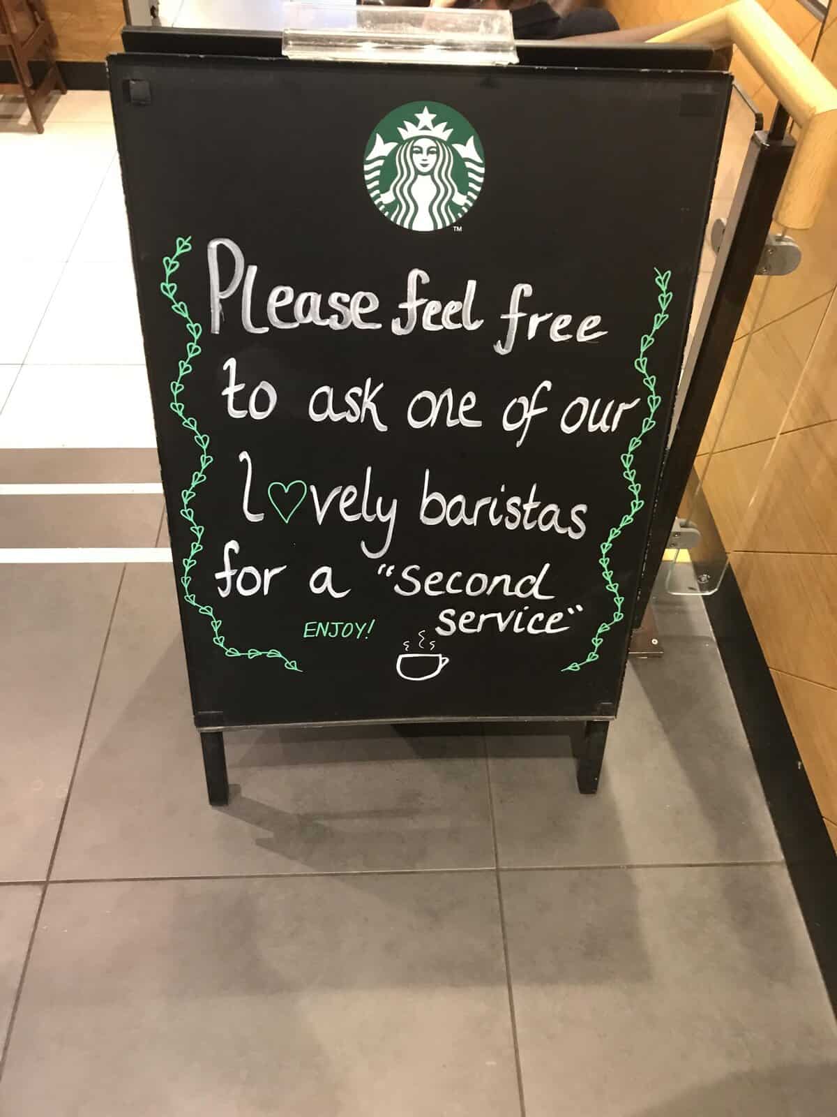 Starbucks chalkboard offering a “second service” from baristas