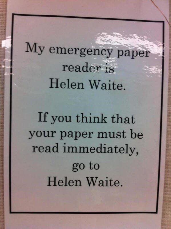 A clever teacher prank using a pun on a sign to tell students to wait patiently.
