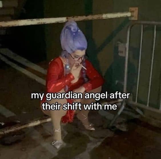 Drag queen in red sequin dress squatting in exhaustion, smoking
