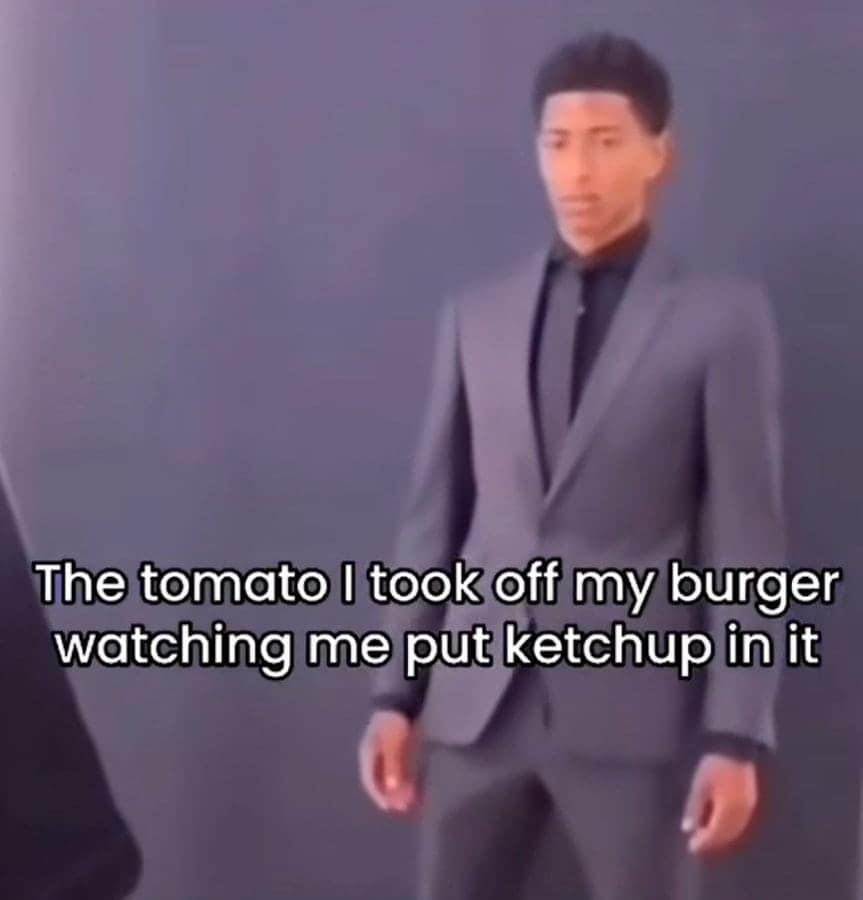 Man in grey suit staring blankly, ketchup irony meme