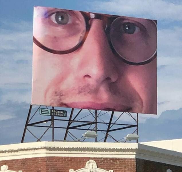 One of the worst ads ever, an unsettlingly close-up photo of a man's face on a billboard.