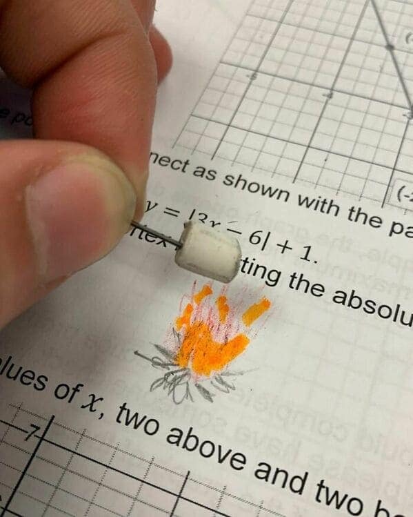 A blursed image of someone roasting a marshmallow on a tiny, hand-drawn fire.