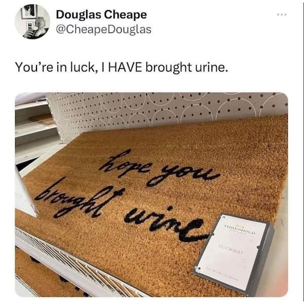 Doormat reading “hope you brought wine,” accompanied by tweet joking “you’re in luck, I HAVE brought urine.”