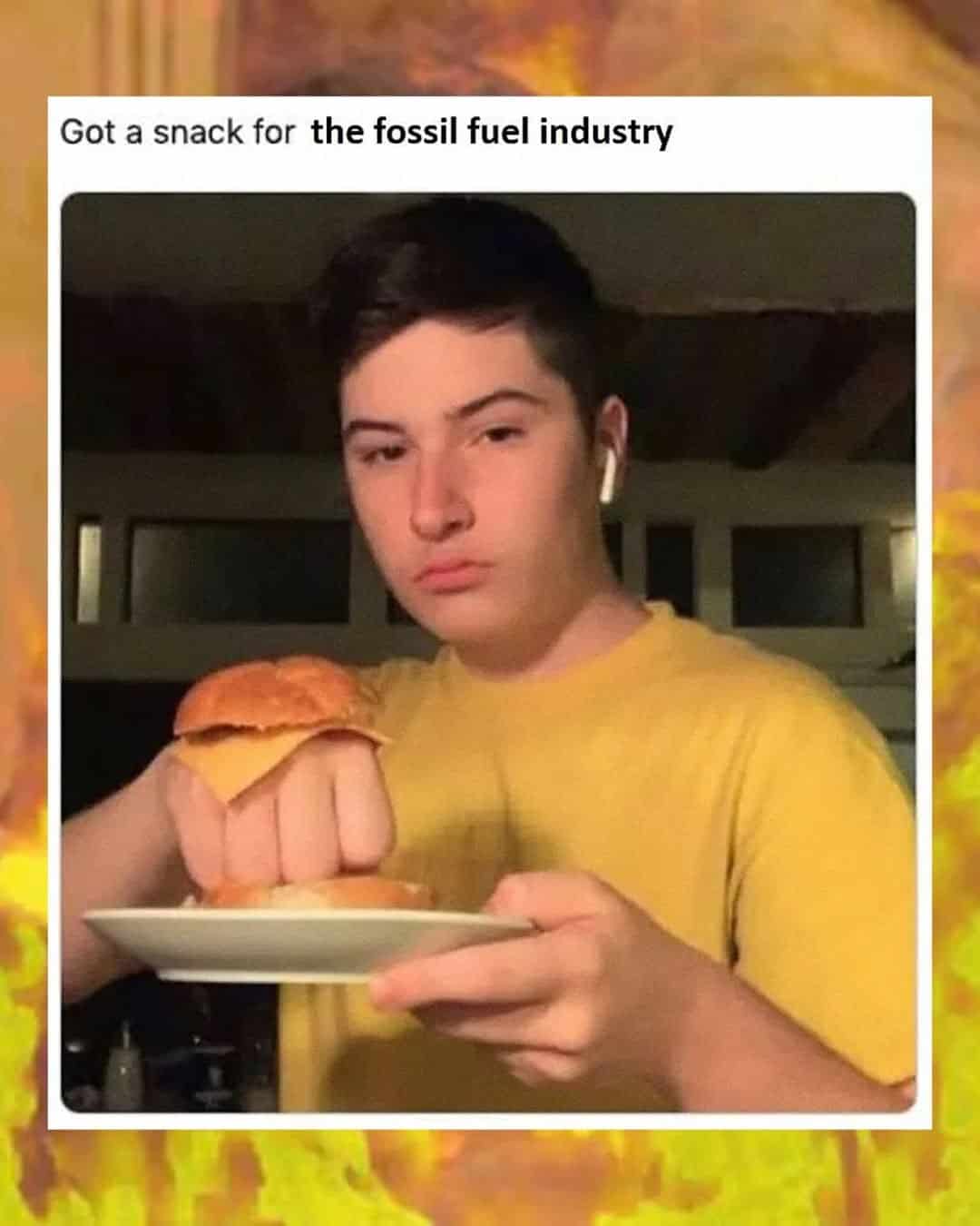 A climate change meme of someone aggressively holding a cheeseburger as a "snack for the fossil fuel industry."