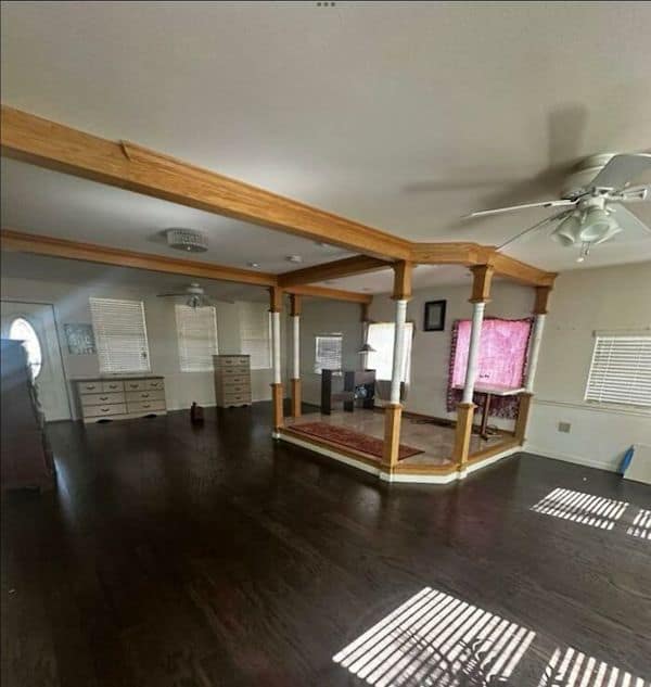 A construction fail of a living room with a bizarre, randomly placed gazebo-like structure.