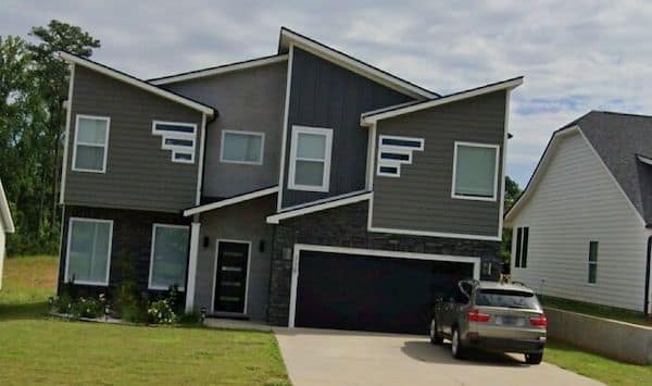 A construction fail of a modern house with a very chaotic and asymmetrical exterior design.