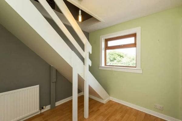 A construction fail showing a staircase that leads directly into the ceiling with no door.