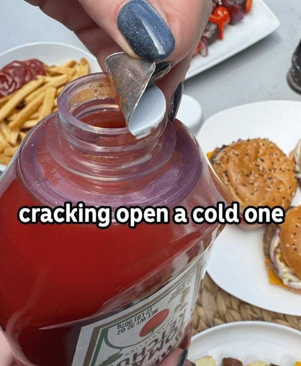 A funny cooking meme joking that opening a new bottle of ketchup is like "cracking open a cold one" with the boys.
