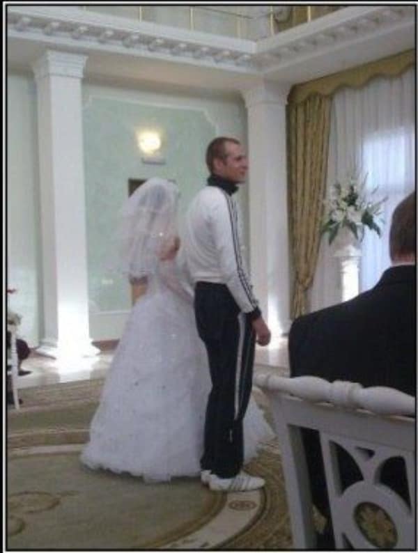 A funny couple meme of a groom wearing a full white and black tracksuit to his wedding ceremony.