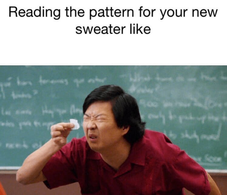 Person squinting at a tiny paper in a classroom with caption about reading a sweater pattern