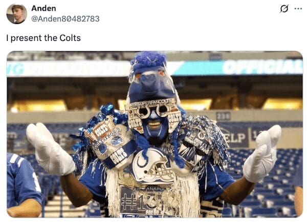 An Indianapolis Colts superfan wearing an elaborate blue costume with a horse mask, face paint, and team gear.