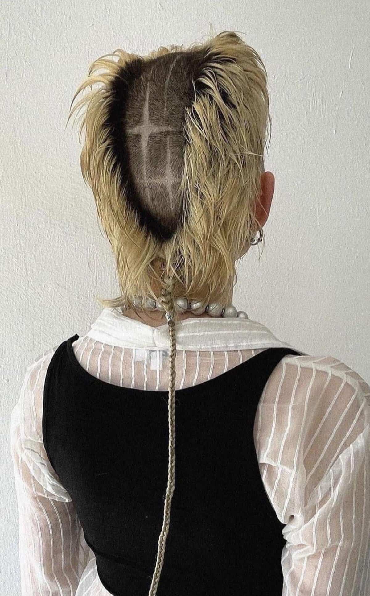 A cursed image of a person with a very bizarre and intricate haircut with a long rat-tail braid.