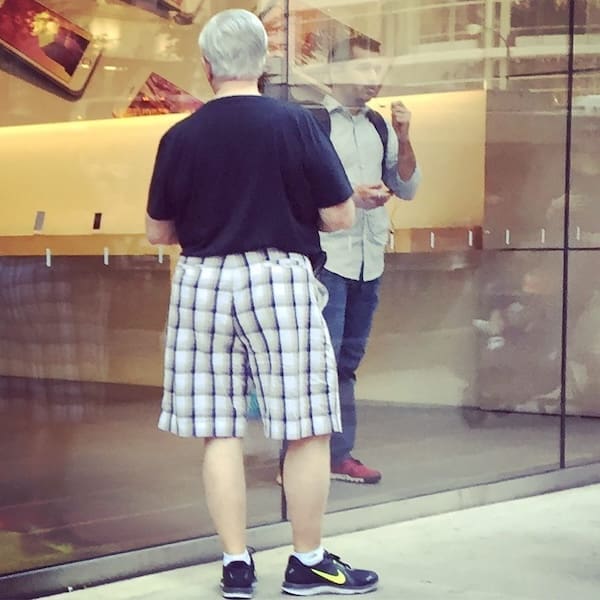 A simple but effective dad fit combining comfortable plaid shorts with athletic shoes and classic white socks.