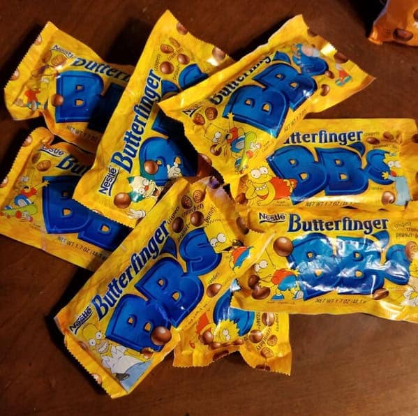 Nostalgic yellow packages of the discontinued Nestlé candy, Butterfinger BB's, featuring characters from The Simpsons.