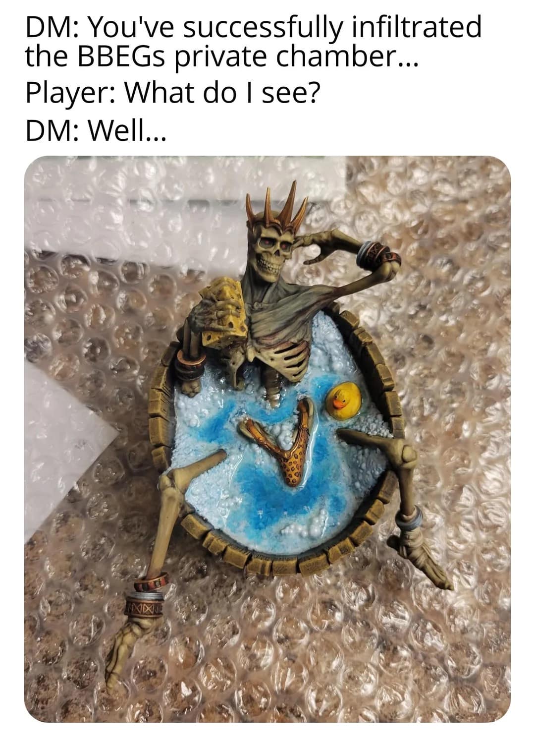 Miniature skeleton king lounging in a bubbly tub with cheese and a rubber duck; captioned DM/Player exchange.