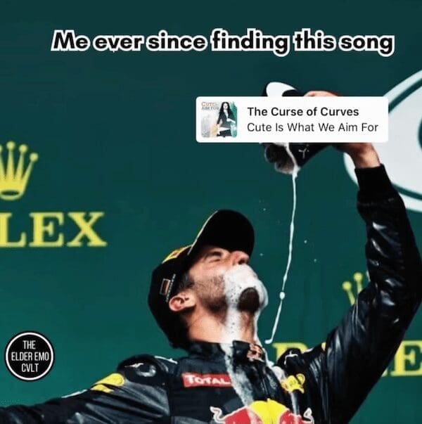 A meme of a Formula 1 driver celebrating with champagne, used to represent the pure joy of discovering the classic 2000s emo song "The Curse of Curves" by Cute Is What We Aim For.