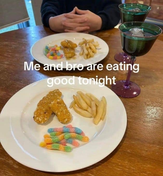 A food meme of a fancy dinner for two, consisting of chicken tenders, fries, and gummy worms.