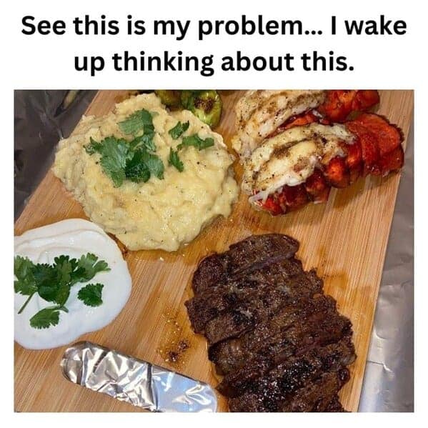 Wooden board feast with grilled steak, mashed potatoes, lobster tails, sour cream, and herbs; caption says it’s all they think about.