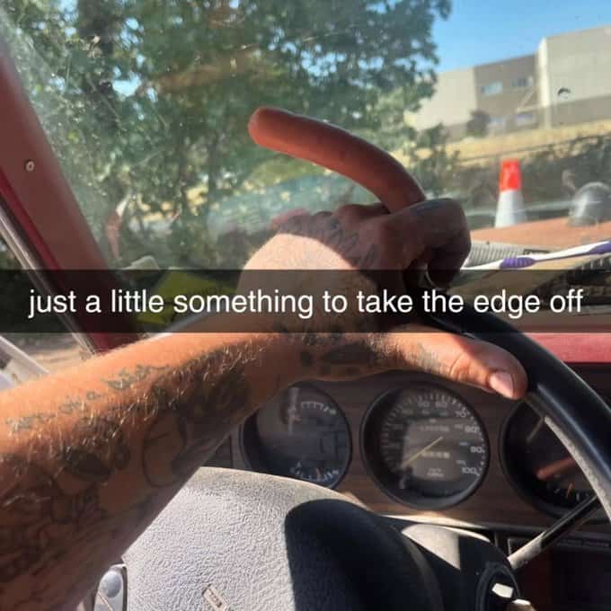 A food meme of a man holding a hot dog between his fingers like he is smoking a cigar.